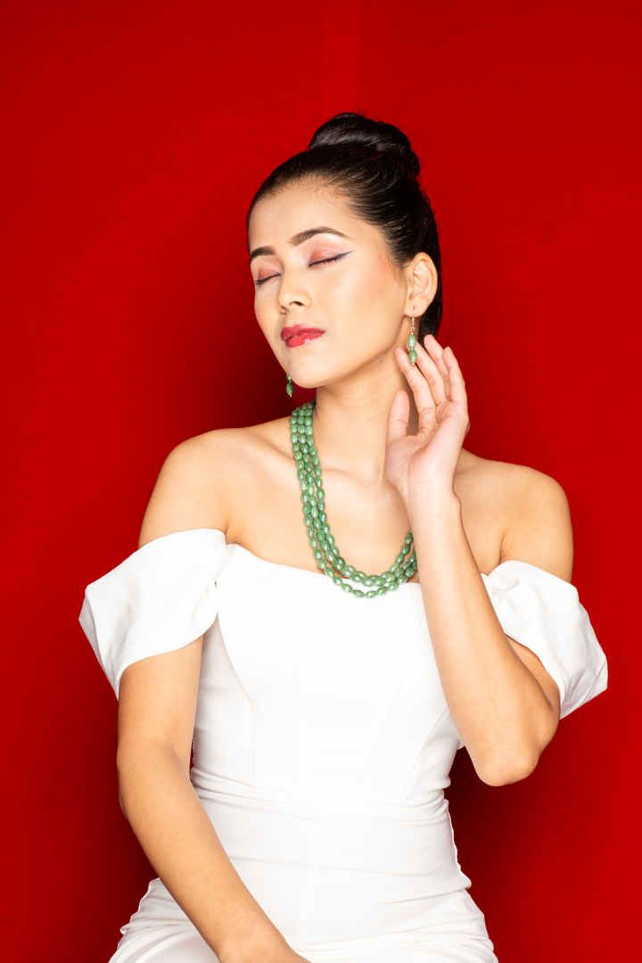 Multi-layered Green Beaded Necklace with matching drop Earrings.