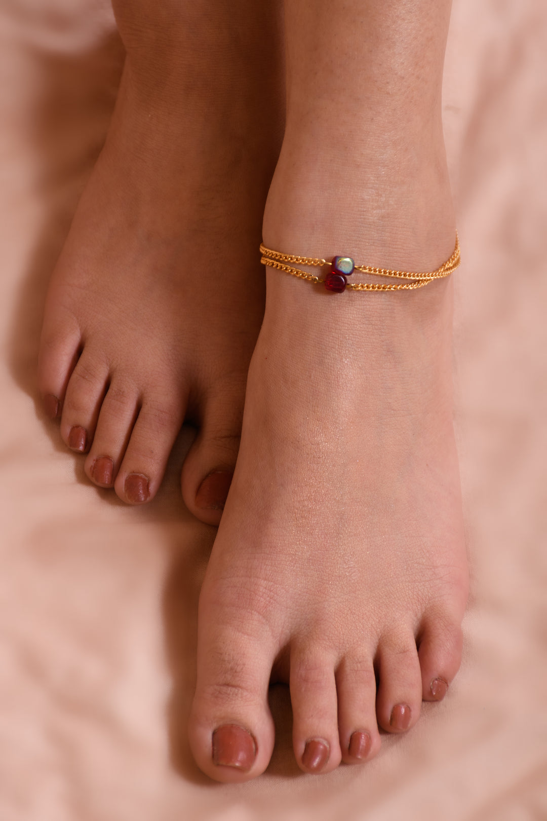 Stylish Red Glass Beads Anklet Strung In Gold Polished Metal Chain