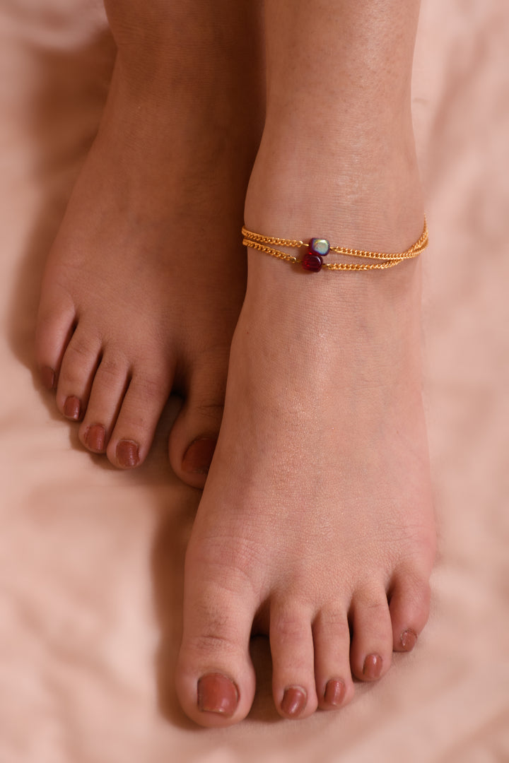 Stylish Red Glass Beads Anklet Strung In Gold Polished Metal Chain