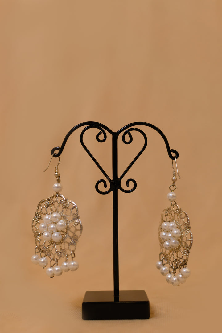 Metal Charms Earring Strung With Pearl Beads On It