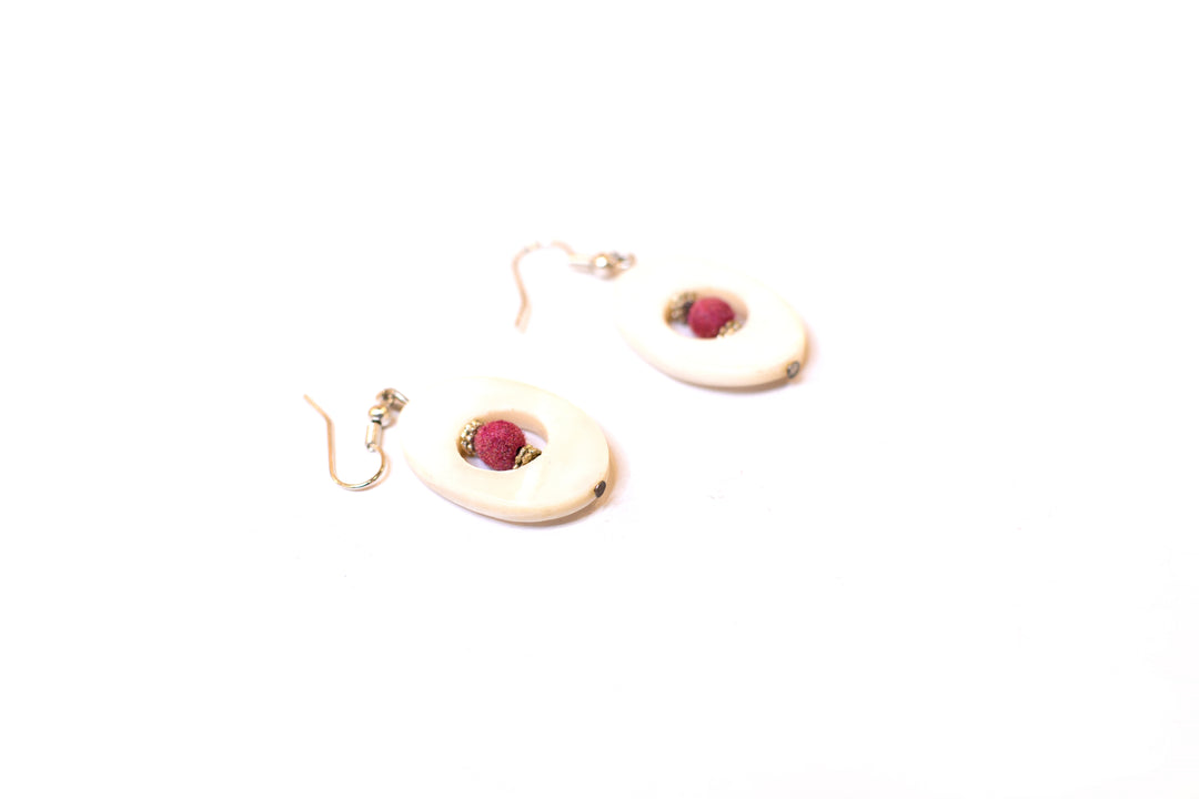 Scooped Shell Earing With Red Beads Strung Inside