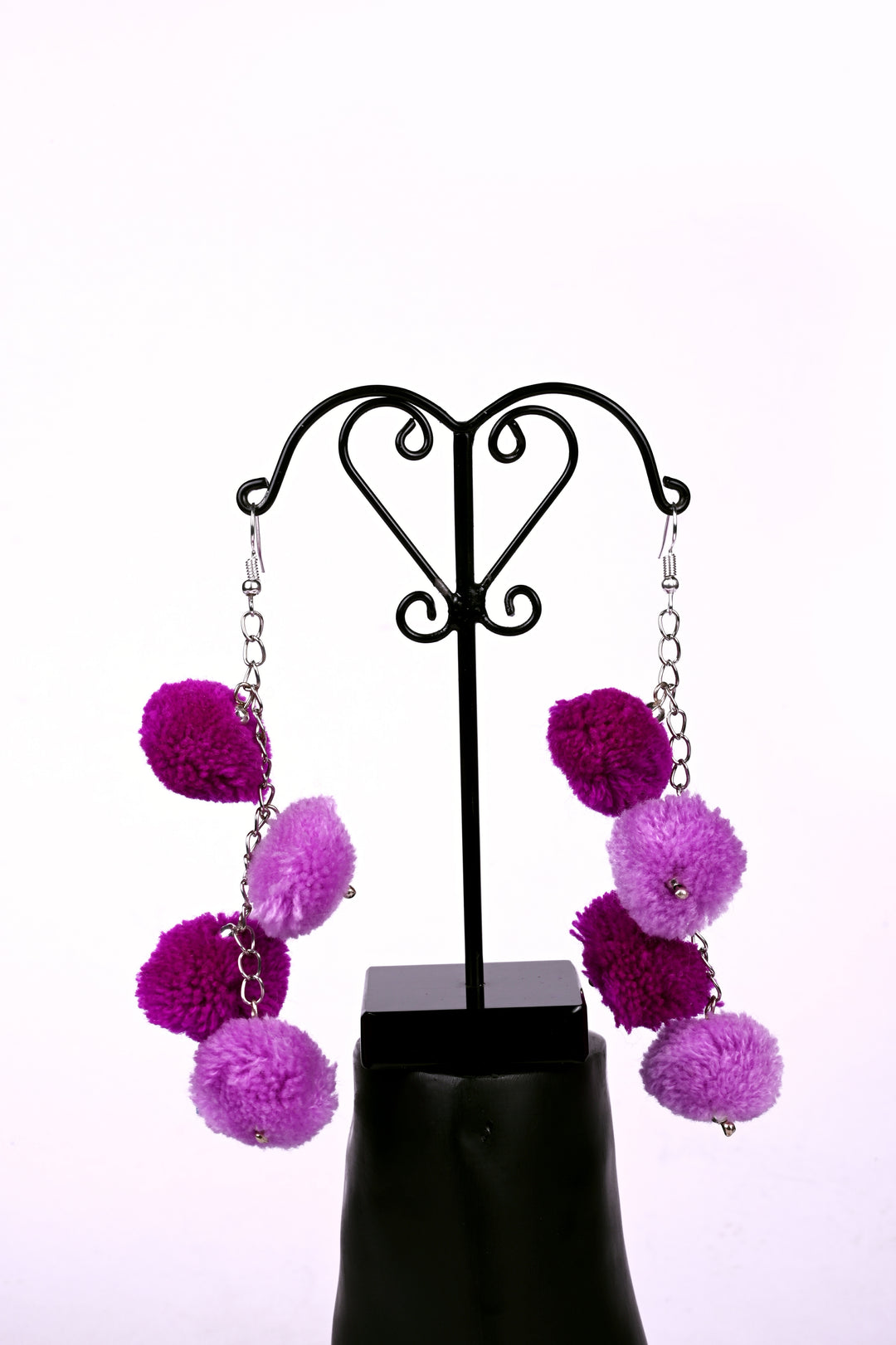 Metal Chain Earring Styled With Dual Tone Purple Colored Pom Balls