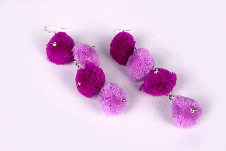 Metal Chain Earring Styled With Dual Tone Purple Colored Pom Balls