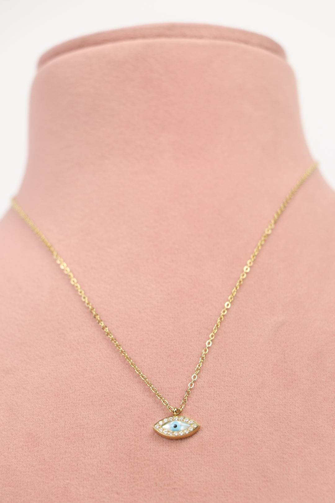 Delemon high-quality gold plated chain necklace featuring a small evil eye pendant with a mother-of-pearl center and crystal border front view.