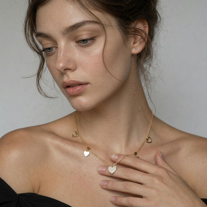 Delemon high-quality gold plated chain necklace featuring a central crystal pave heart pendant with hanging solid and open heart charms