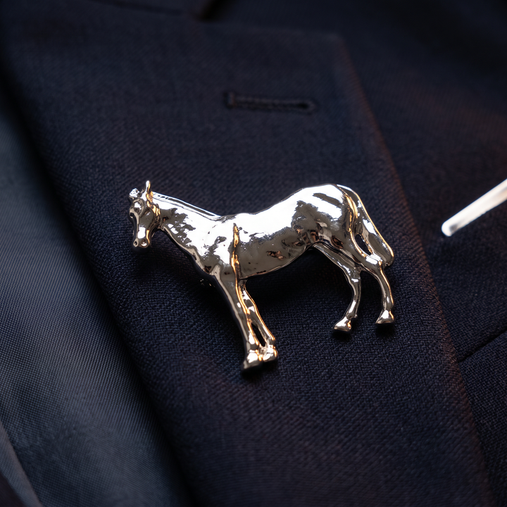 High-shine silver-tone horse brooch pin with a standing stallion silhouette