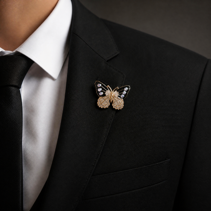 Black and white enamel butterfly brooch pin with iridescent AB crystals and clear pavé lower wings on a white background by Delemon