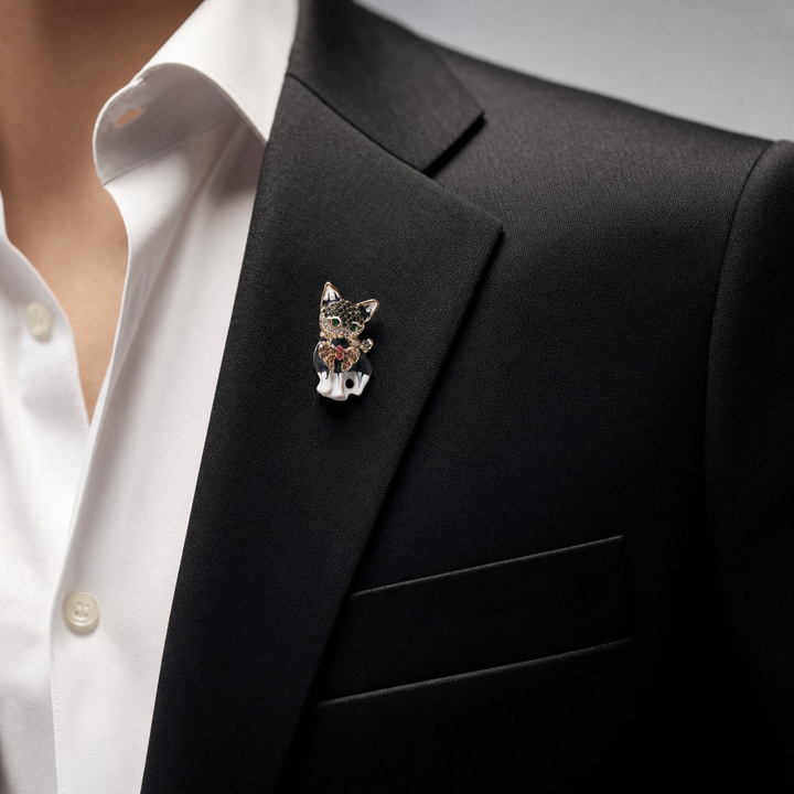 Gold-tone sitting French Bulldog brooch pin with black and white enamel finish, crystal bow tie.
