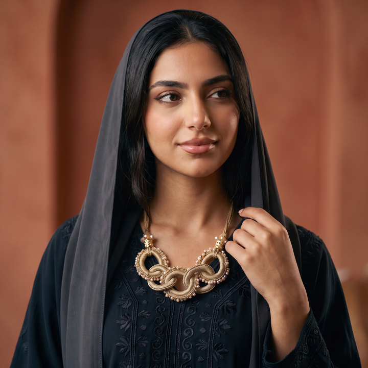 Delemon champagne gold thread-wrapped interlocking ring statement necklace with crystal edging