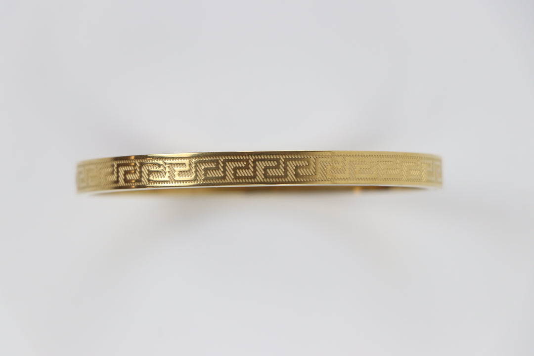 Delemon gold Greek key engraved geometric bangle bracelet in waterproof 18k gold plated stainless steel