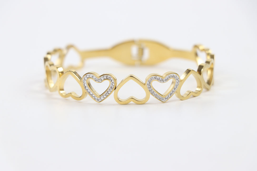 Delemon gold open-heart interlocking link bangle bracelet with alternating pavé crystal hearts in waterproof 18k gold plated stainless steel