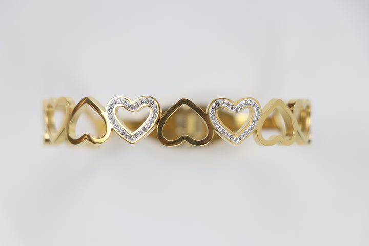 Delemon gold open-heart interlocking link bangle bracelet with alternating pavé crystal hearts in waterproof 18k gold plated stainless steel