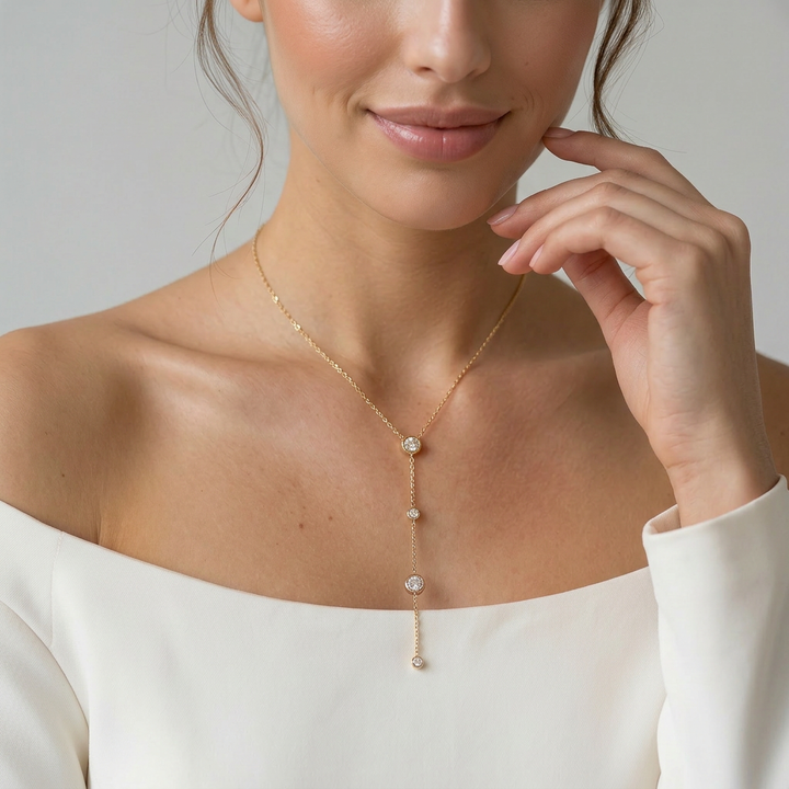Delemon high-quality gold plated delicate Y-shaped drop necklace featuring round bezel-set clear crystal
