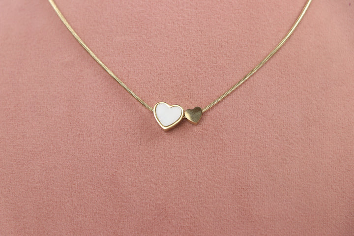 Delemon high-quality gold plated snake chain necklace featuring a white enamel heart pendant alongside a mini solid gold heart charm.