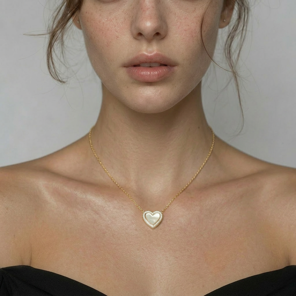 Delemon high-quality gold plated chain necklace featuring a central heart pendant with a white mother-of-pearl center and crystal border