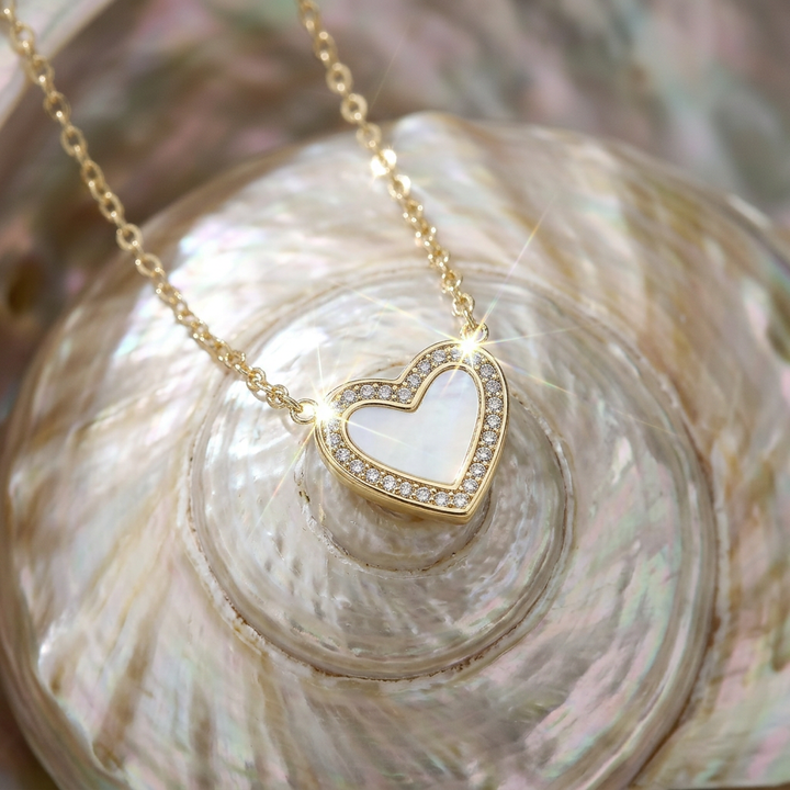 Delemon high-quality gold plated chain necklace featuring a central heart pendant with a white mother-of-pearl center and crystal border