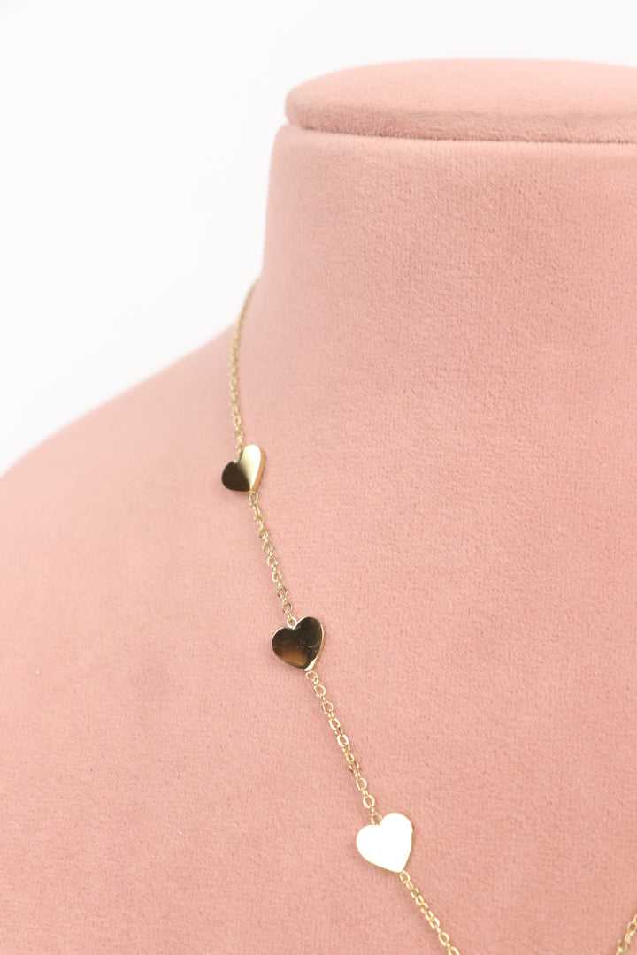 Delemon high-quality gold plated chain necklace featuring multiple delicate heart charms in a station design side close-up view.