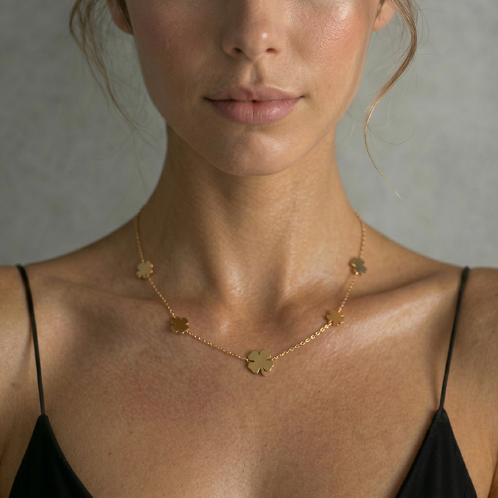 Delemon high-quality gold plated delicate chain necklace featuring multiple small four-leaf clover charms