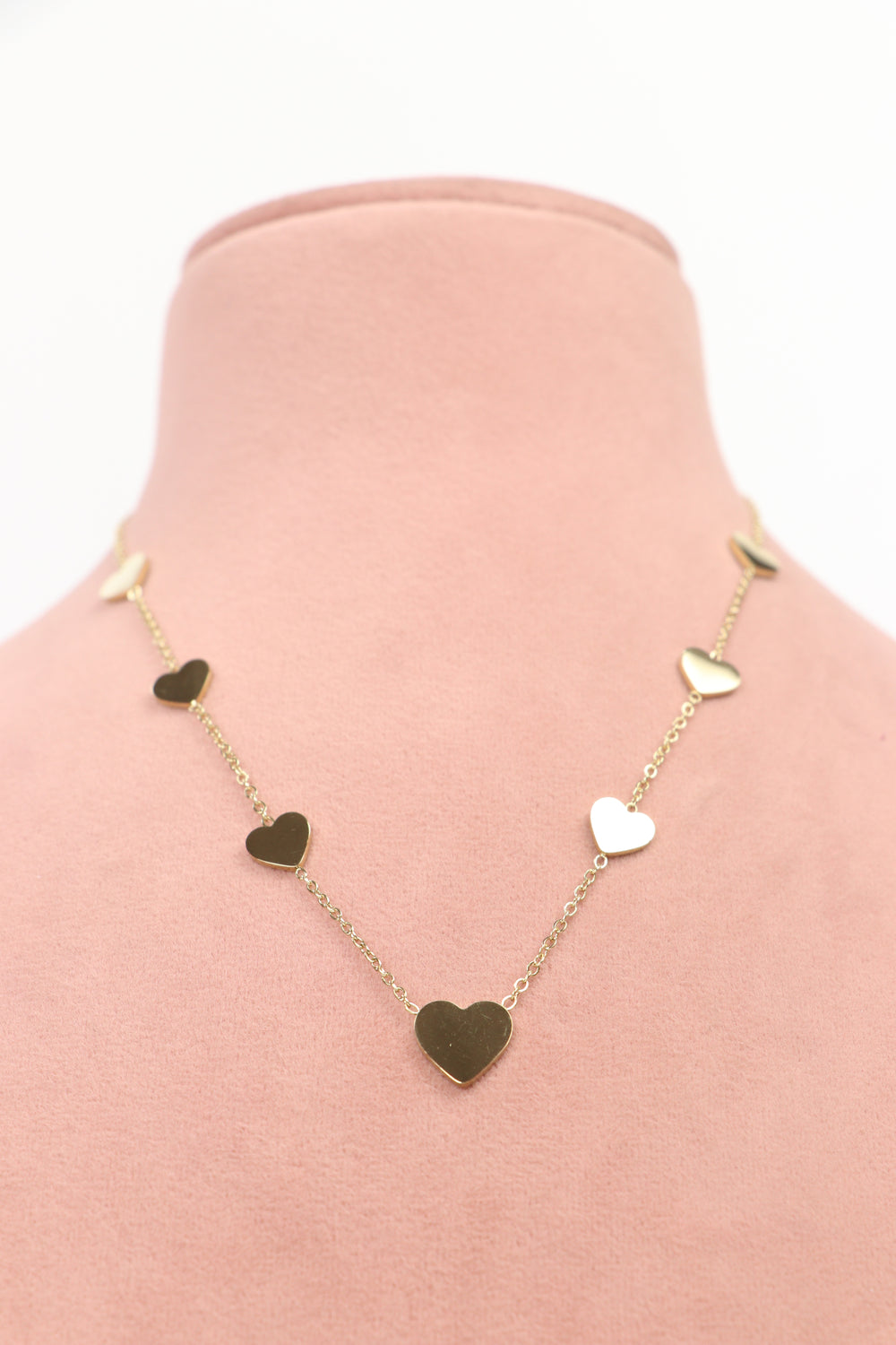 Delemon high-quality gold plated chain necklace featuring multiple delicate heart charms in a station design front view.