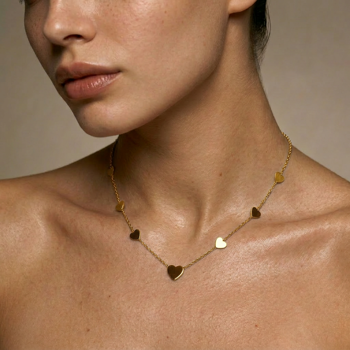 Delemon high-quality gold plated chain necklace featuring multiple delicate heart charms in a station design