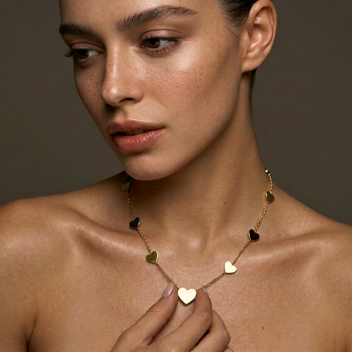 Delemon high-quality gold plated chain necklace featuring multiple delicate heart charms in a station design