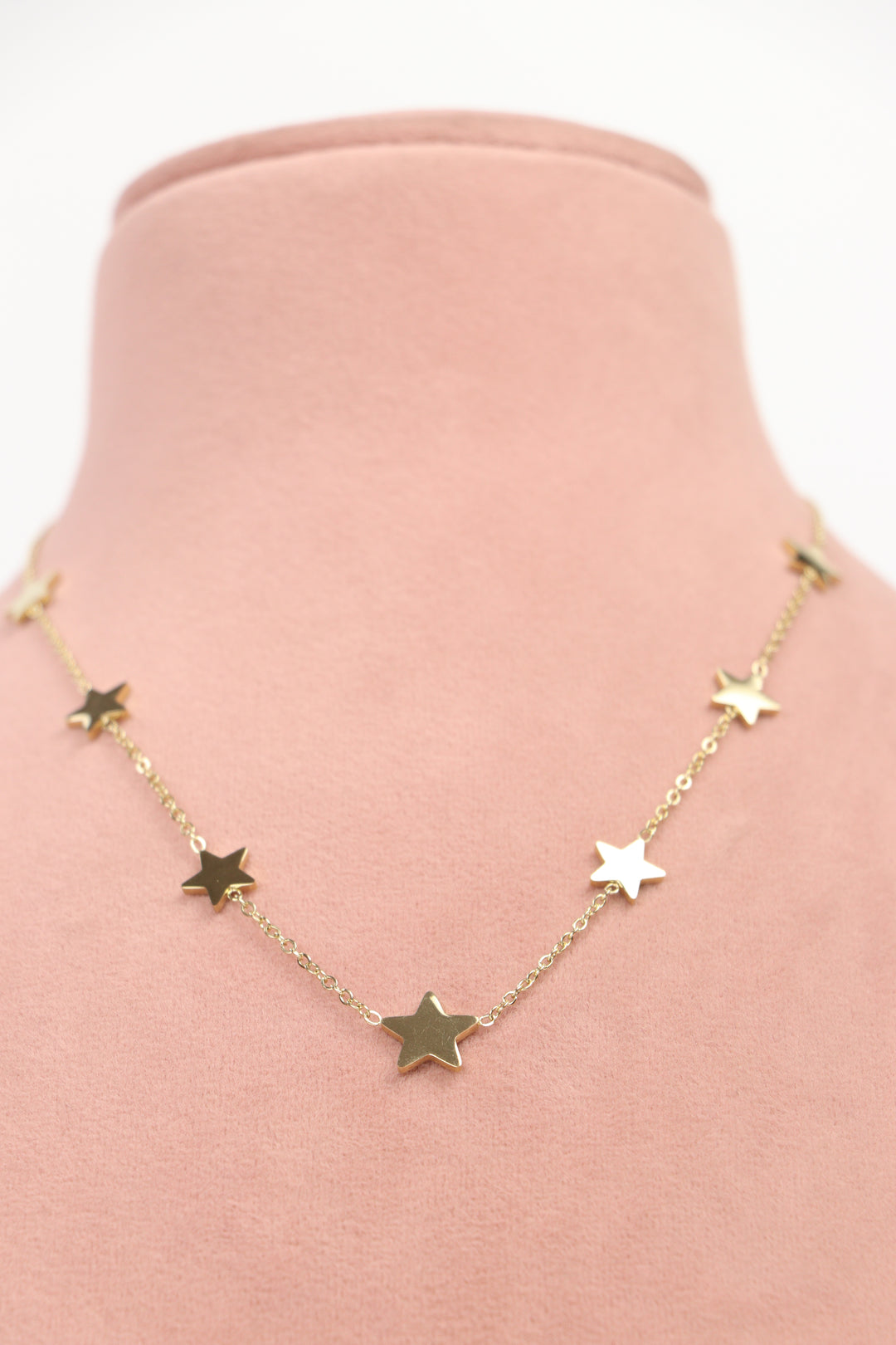 Delemon high-quality gold plated chain necklace featuring multiple delicate star charms in a station design front view.