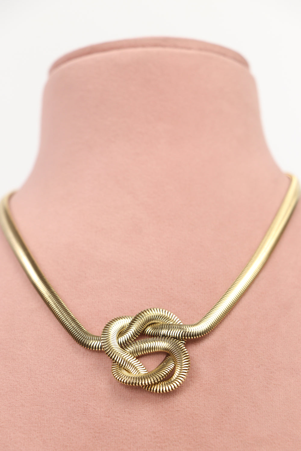 Delemon high-quality gold plated thick snake chain necklace featuring a central statement love knot design front view.