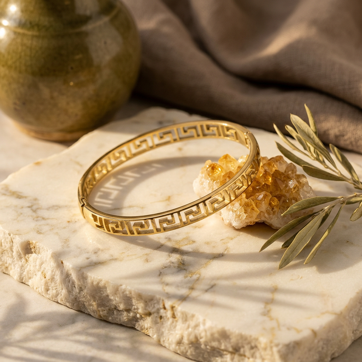Delemon gold slim Greek key cut-out geometric bangle bracelet in waterproof 18k gold plated stainless steel