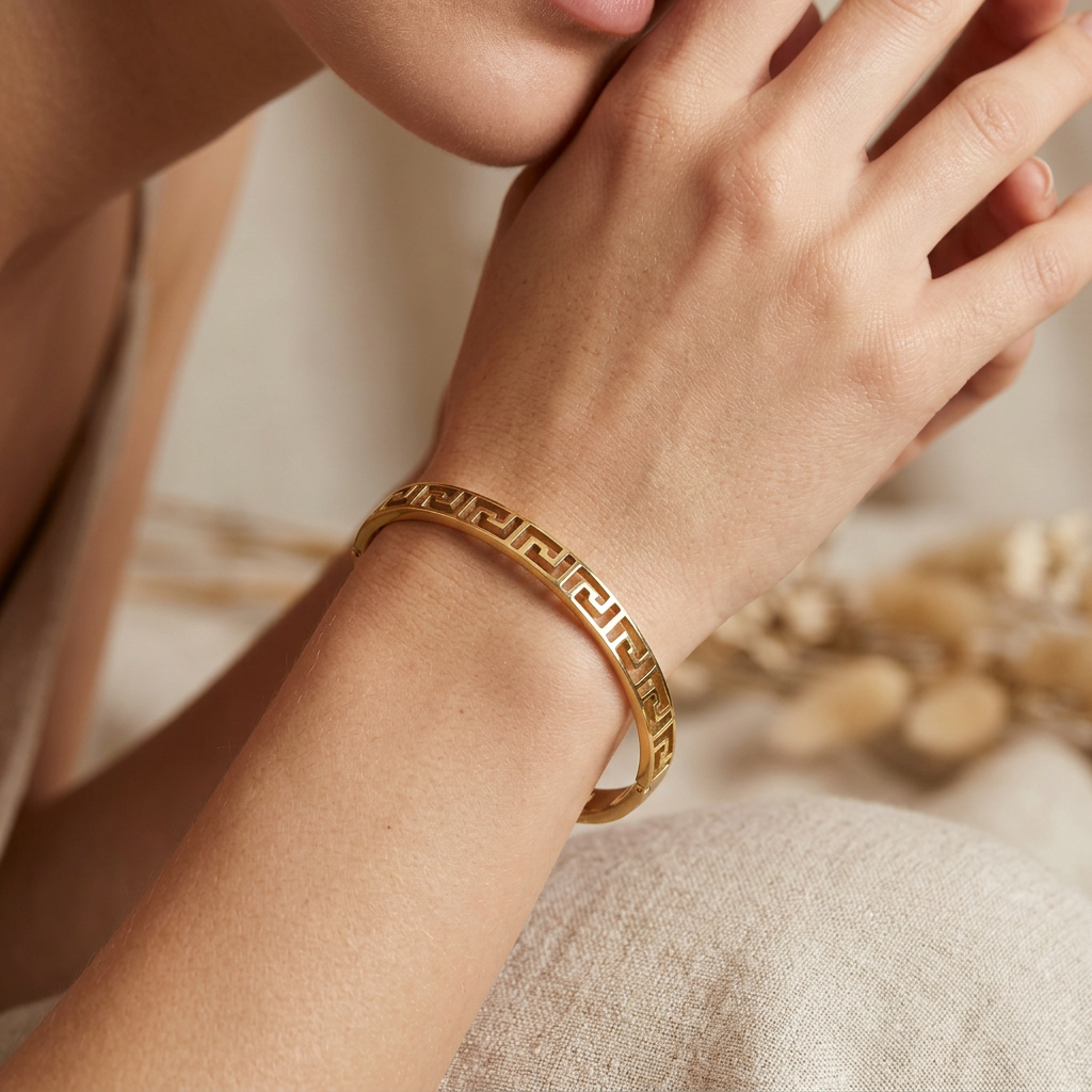 Delemon gold slim Greek key cut-out geometric bangle bracelet in waterproof 18k gold plated stainless steel