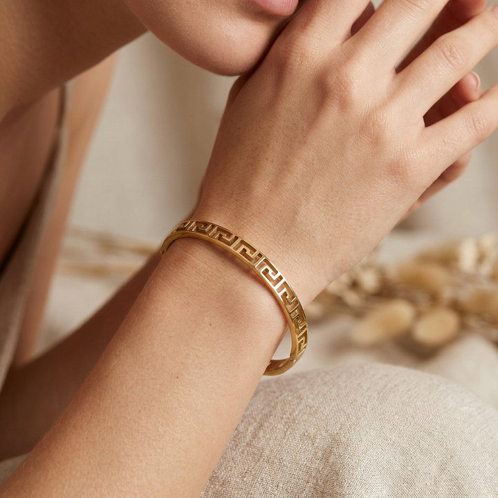 Delemon gold slim Greek key cut-out geometric bangle bracelet in waterproof 18k gold plated stainless steel