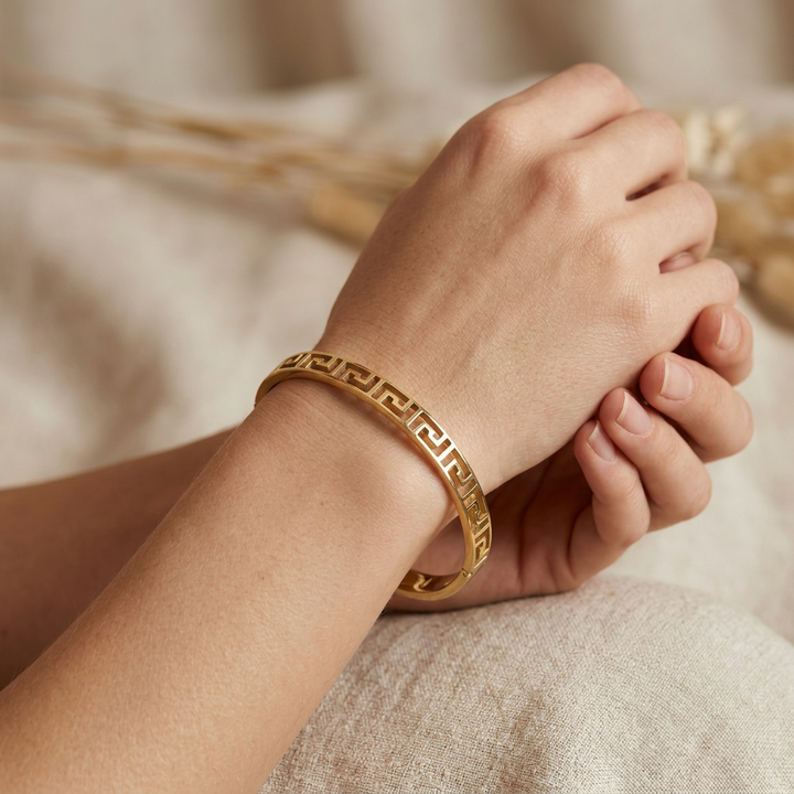 Delemon gold slim Greek key cut-out geometric bangle bracelet in waterproof 18k gold plated stainless steel