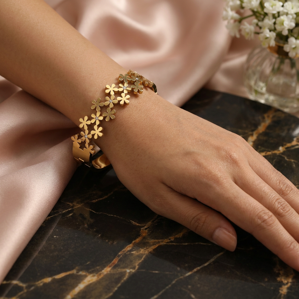 Delemon high-quality gold plated stainless steel bangle bracelet featuring an intricate clustered design of small five-petal flowers accented with delicate crystals