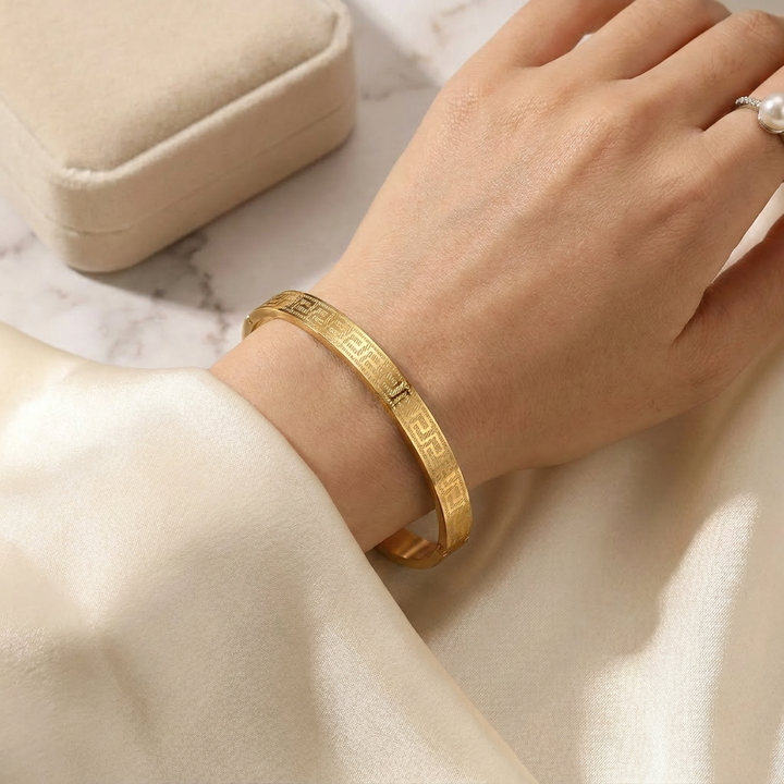 Delemon gold Greek key engraved geometric bangle bracelet in waterproof 18k gold plated stainless steel