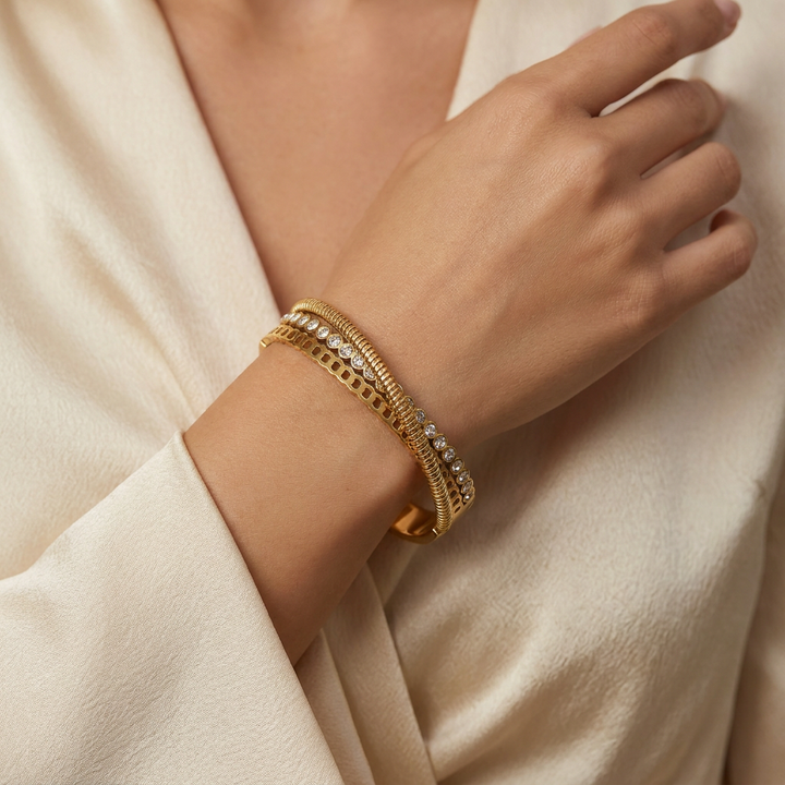 Delemon gold Verona triple layer crossover bangle bracelet with bezel-set crystals and textured rope strands in waterproof 18k gold plated stainless steel