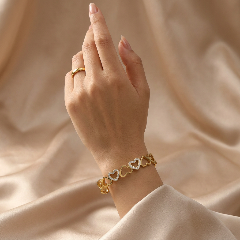 Delemon gold open-heart interlocking link bangle bracelet with alternating pavé crystal hearts in waterproof 18k gold plated stainless steel