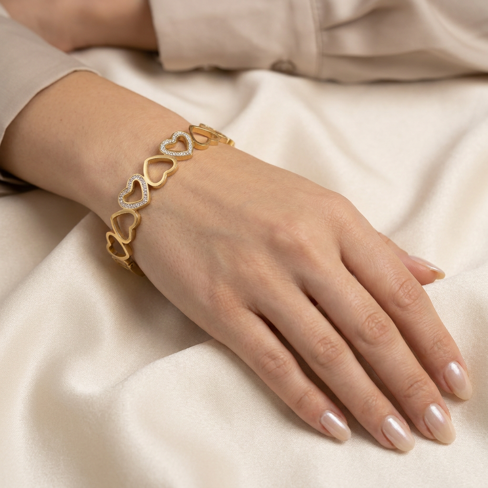 Delemon gold open-heart interlocking link bangle bracelet with alternating pavé crystal hearts in waterproof 18k gold plated stainless steel
