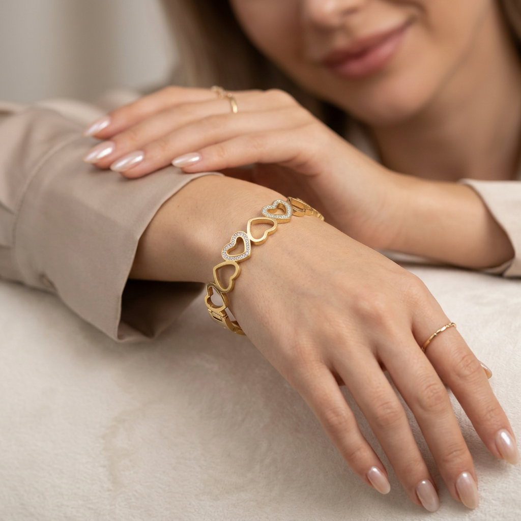 Delemon gold open-heart interlocking link bangle bracelet with alternating pavé crystal hearts in waterproof 18k gold plated stainless steel