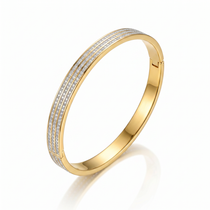 Delemon gold rigid bangle bracelet featuring three rows of clear pavé crystals in waterproof 18k gold plated stainless steel