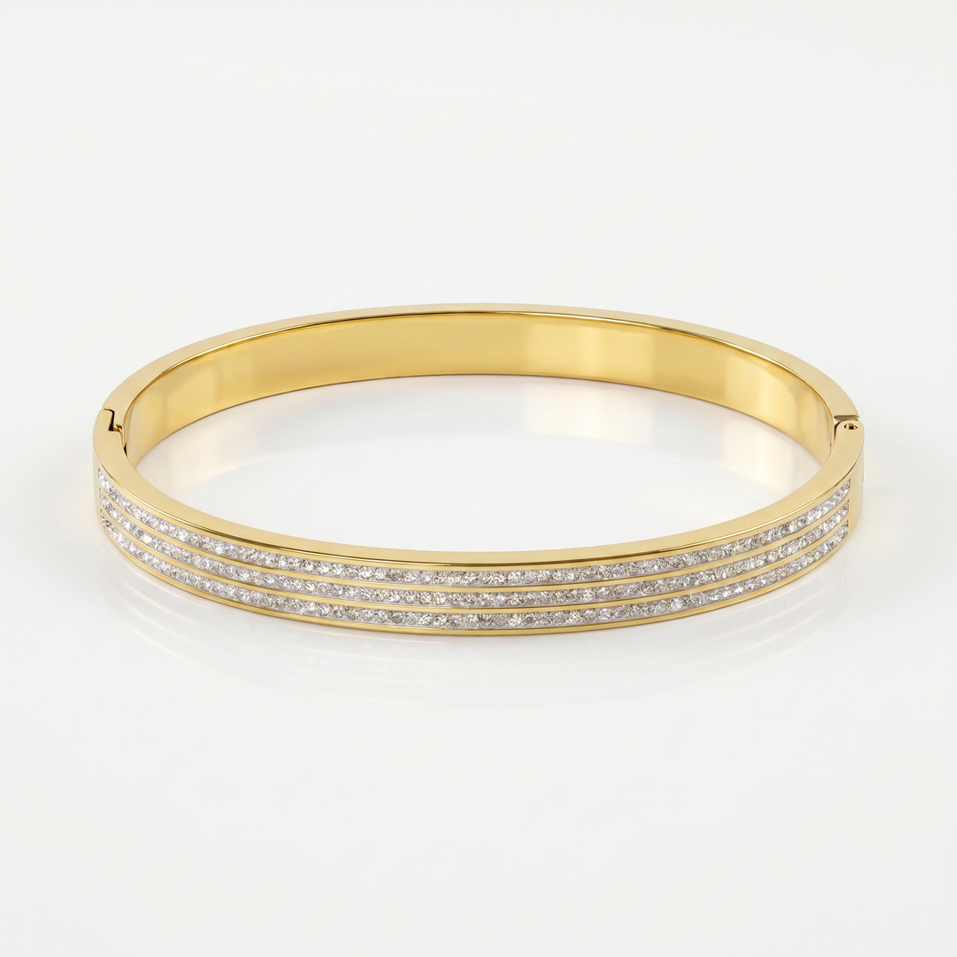 Delemon gold rigid bangle bracelet featuring three rows of clear pavé crystals in waterproof 18k gold plated stainless steel