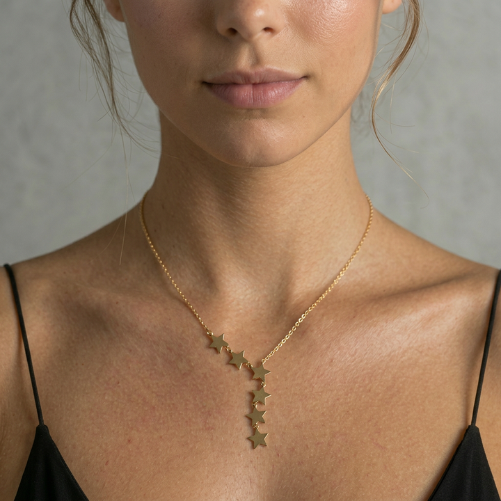 Delemon high-quality gold plated delicate chain necklace featuring an asymmetrical side-swept cascade of small star charms