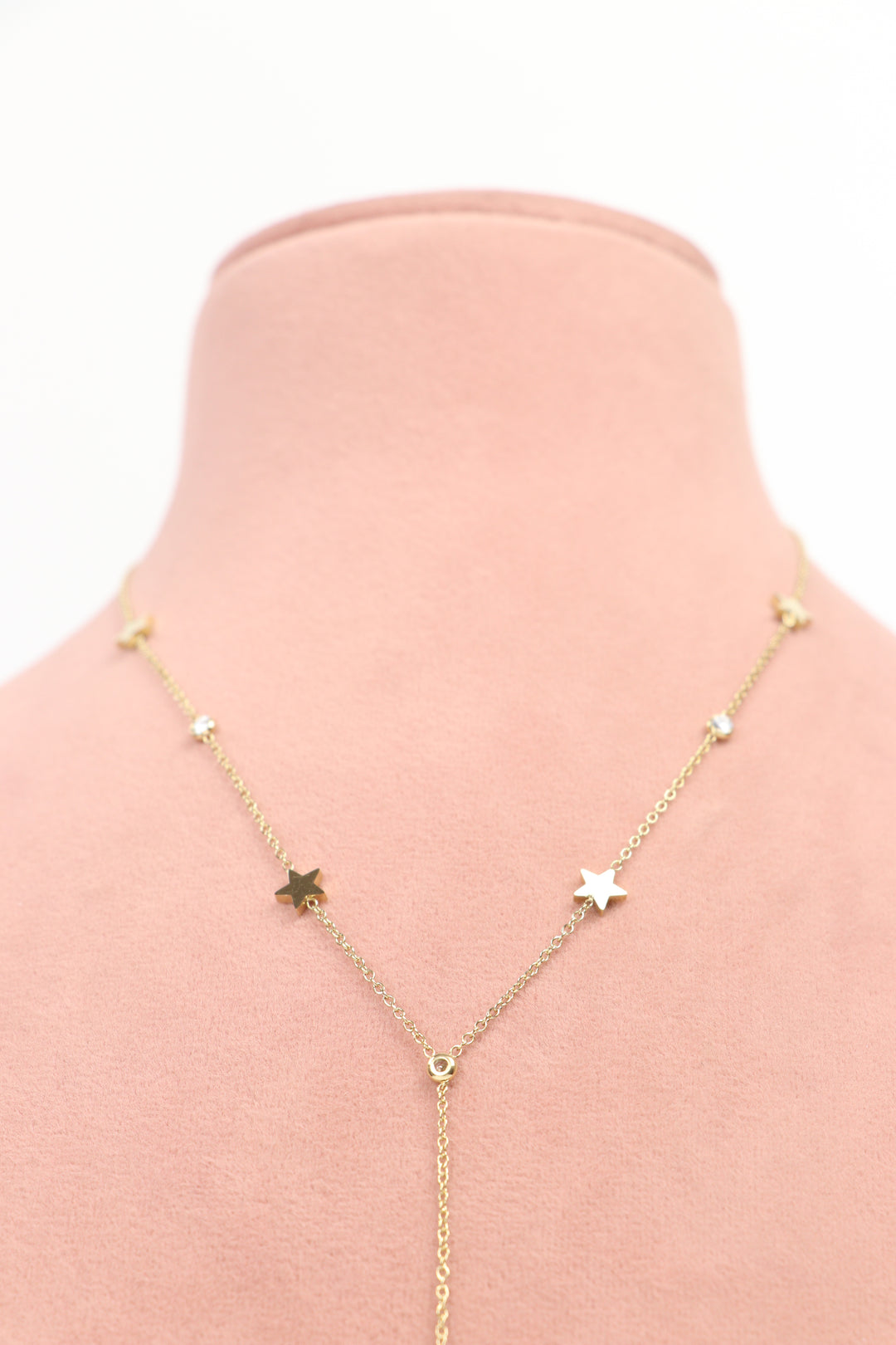 Delemon high-quality gold plated chain lariat necklace featuring star charms and small round crystals close-up view.