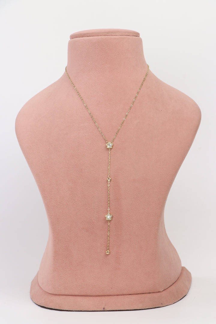 Delemon high-quality gold plated Y-shaped lariat chain necklace with flower and crystal charms front view.
