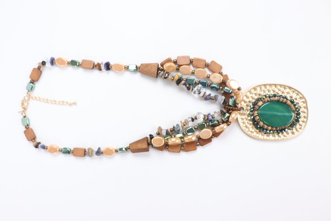 Delemon green cabochon stone on hammered gold oval pendant multi-strand wooden bead necklace