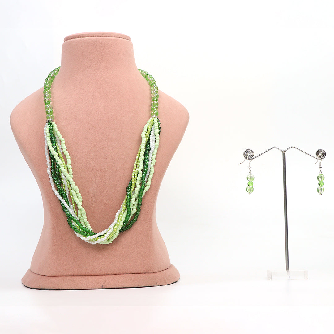 Delemon high-quality multi-strand beaded necklace in shades of green and white seed beads, beautifully paired with matching green drop earrings on a display stand.