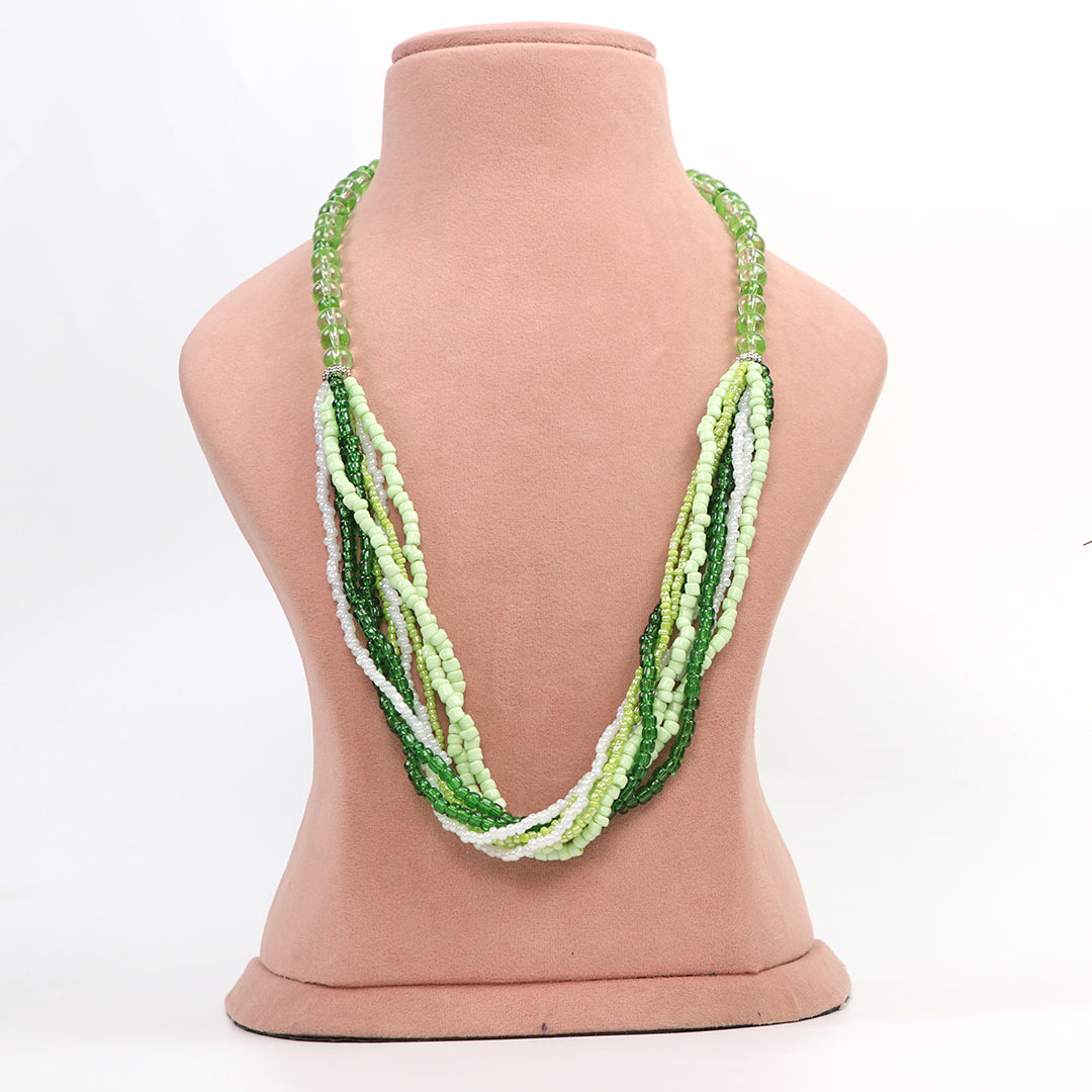 Front view of Delemon high-quality multi-strand necklace made of light green, dark green, and white seed beads on a pink display bust.