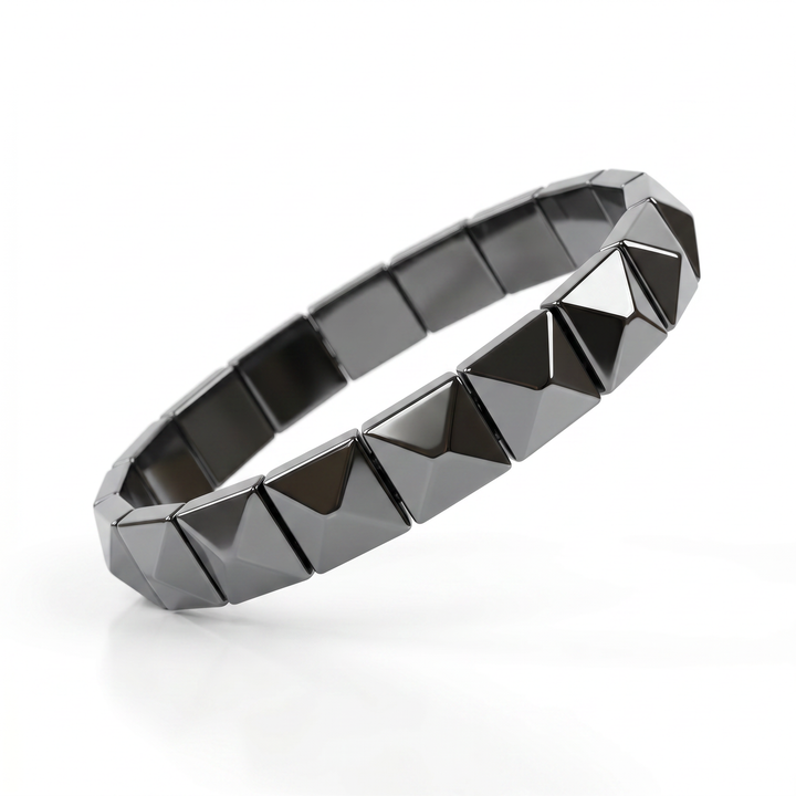Delemon featuring a uniform geometric stretch bracelet with polished square-based pyramid stud hematite