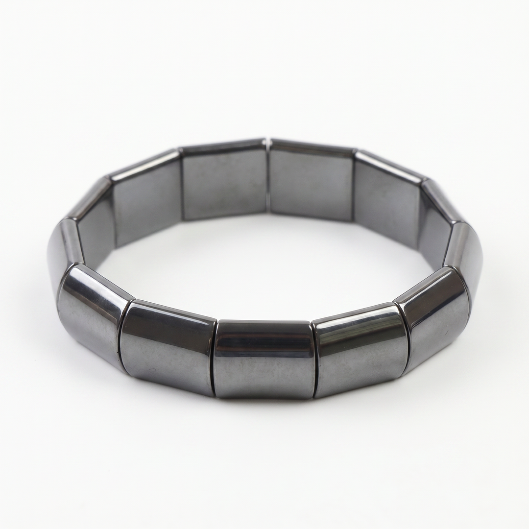 Delemon featuring a uniform chunkier stretch bracelet with large, wide flat-backed polished metallic hematite