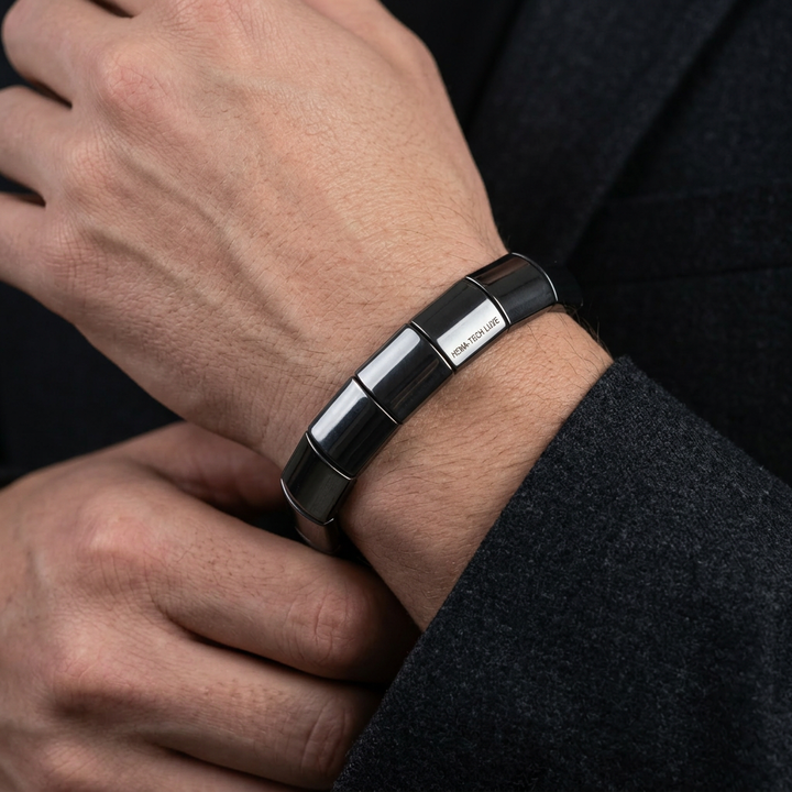 Delemon featuring a uniform chunkier stretch bracelet with large, wide flat-backed polished metallic hematite