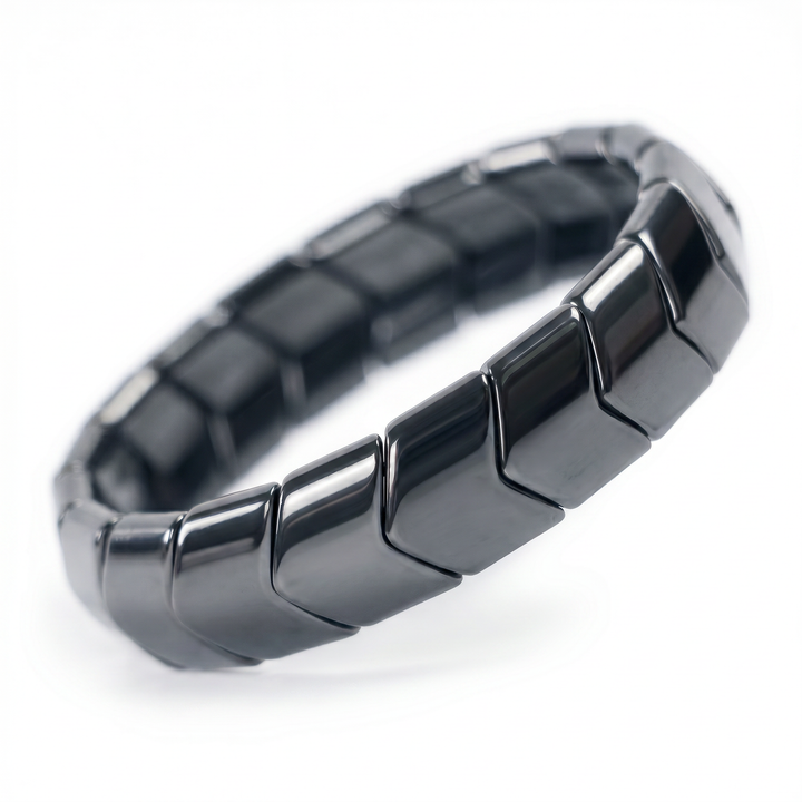 Delemon featuring a uniform chunkier directional stretch bracelet with wide, polished interlocking chevron arrowhead hematite