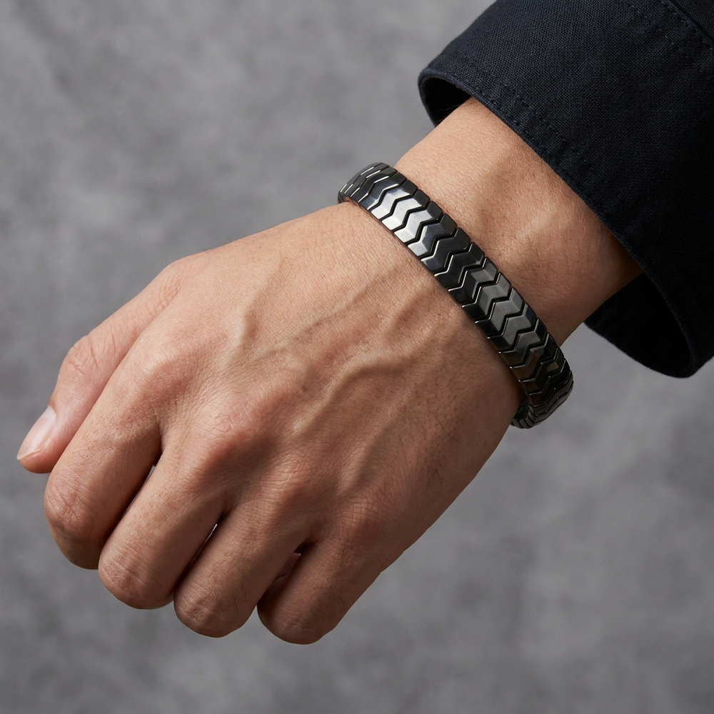 Delemon  featuring a uniform directional stretch bracelet with polished interlocking chevron arrowhead hematite